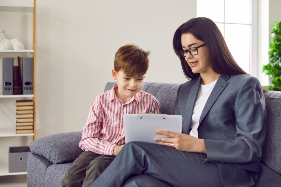 teacher and a student reading a paper